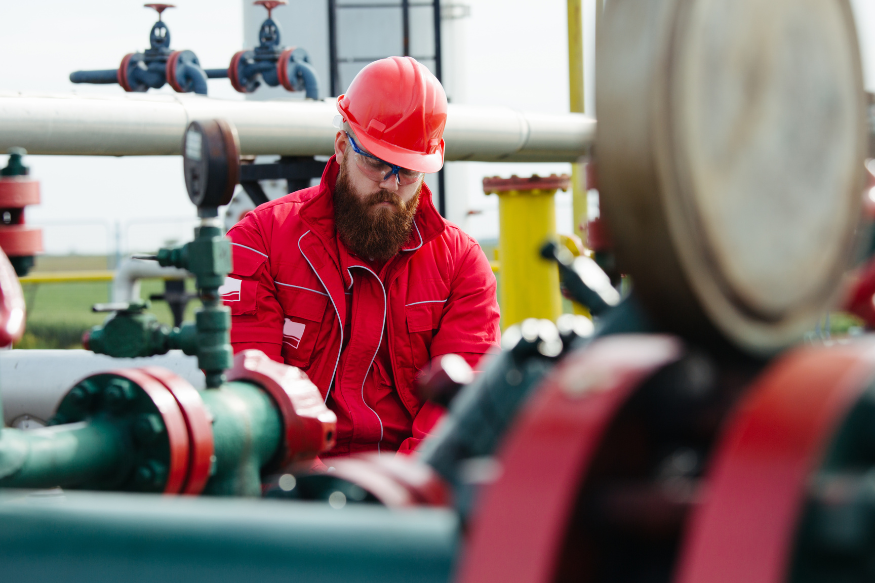 Oil and Gas Industry Worker. Engineer working on pipeline equipment for oil and gas company.